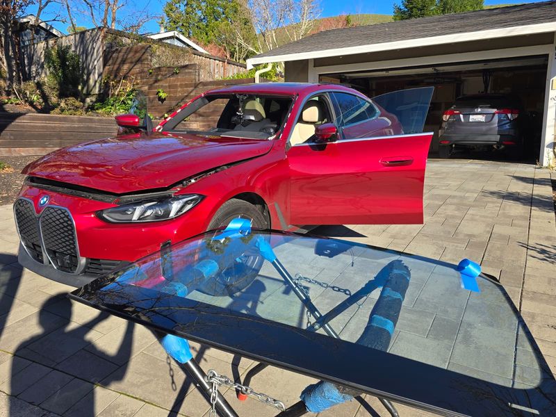 BMW iX windshield on stand ready for installation in the Inland Empire